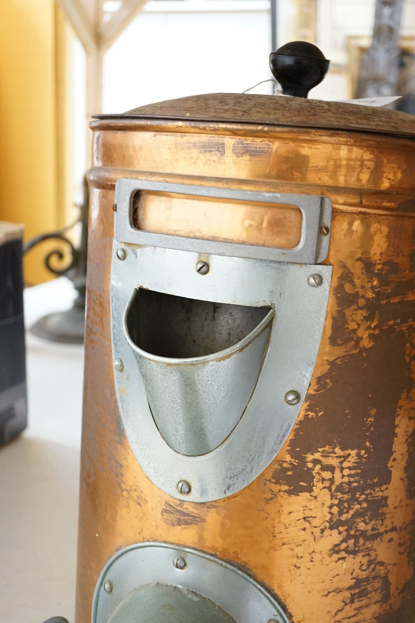 A copper coffee bean dispenser, 60 cms high.